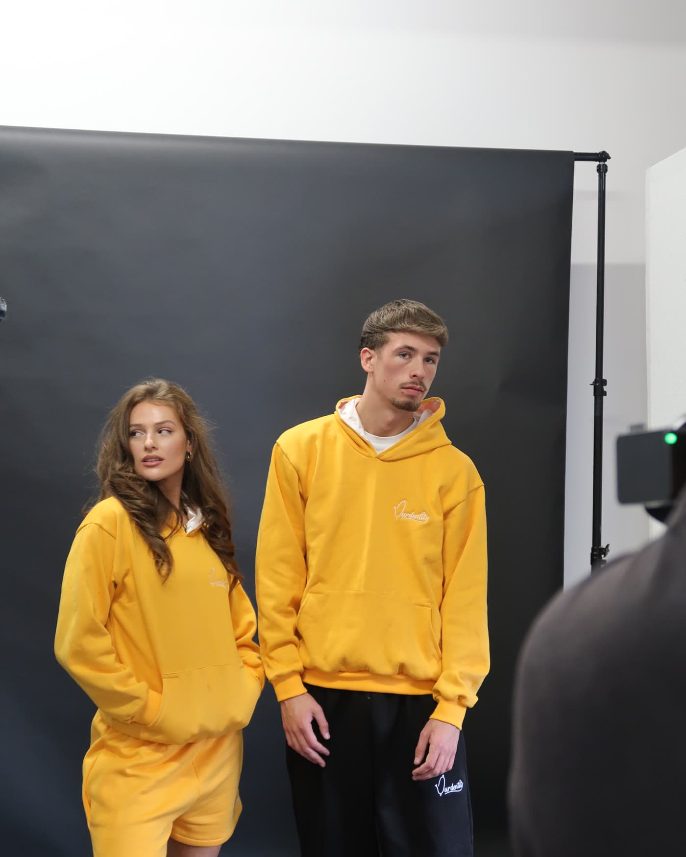 Campaign frame, two models in the yellow colourway