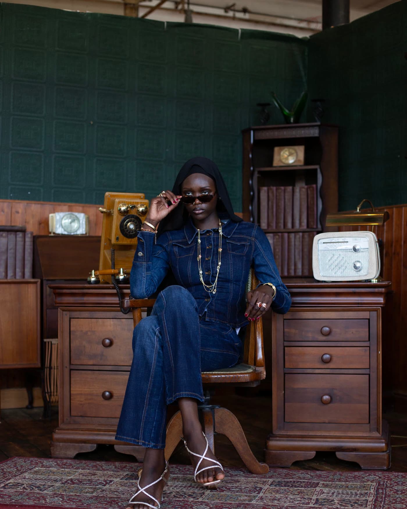 Denim editorial, full length, seated in a period office set